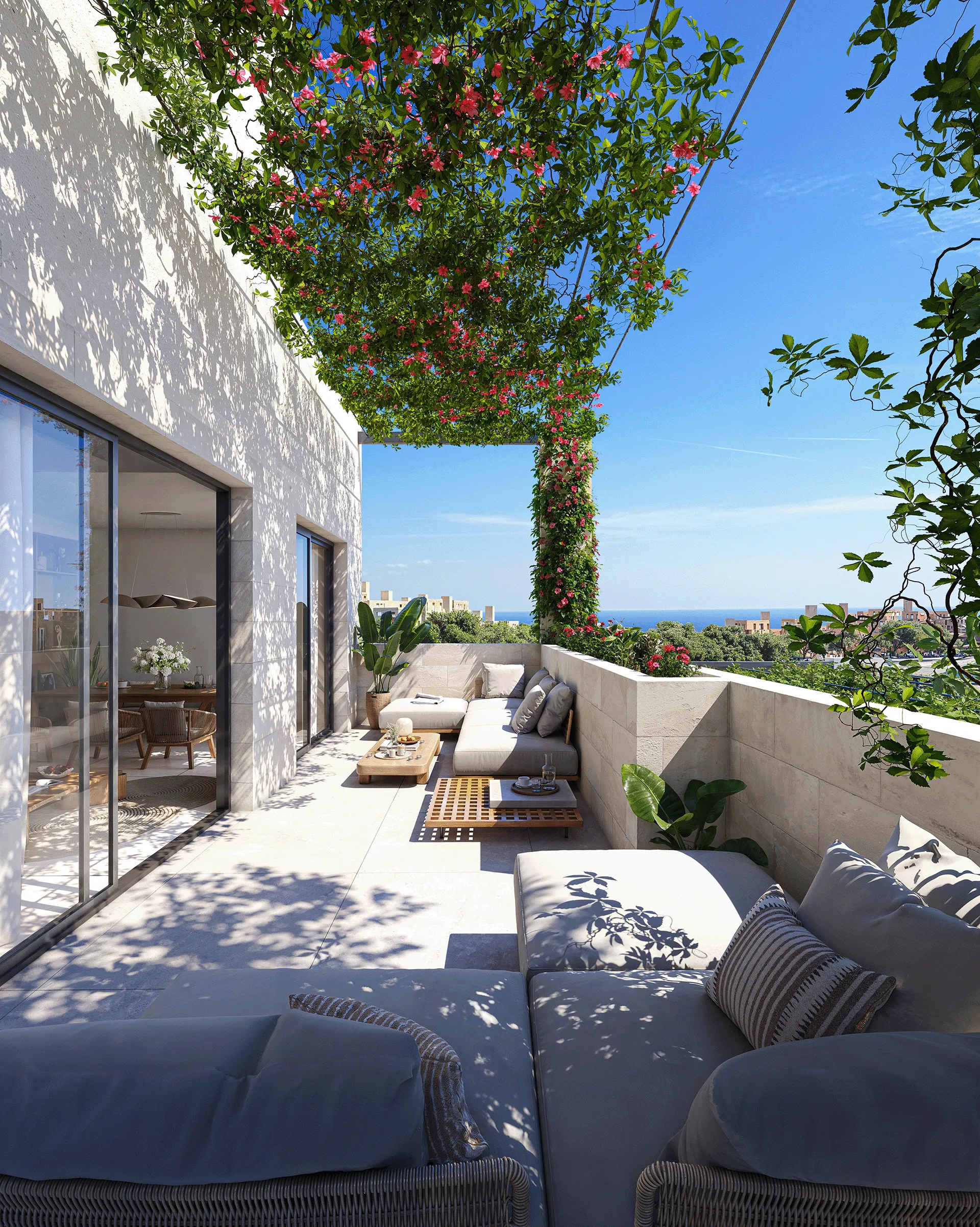 Sunlit terrace with seating and flowering greenery